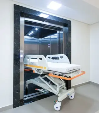 Elevador hospitalar com maca-leito